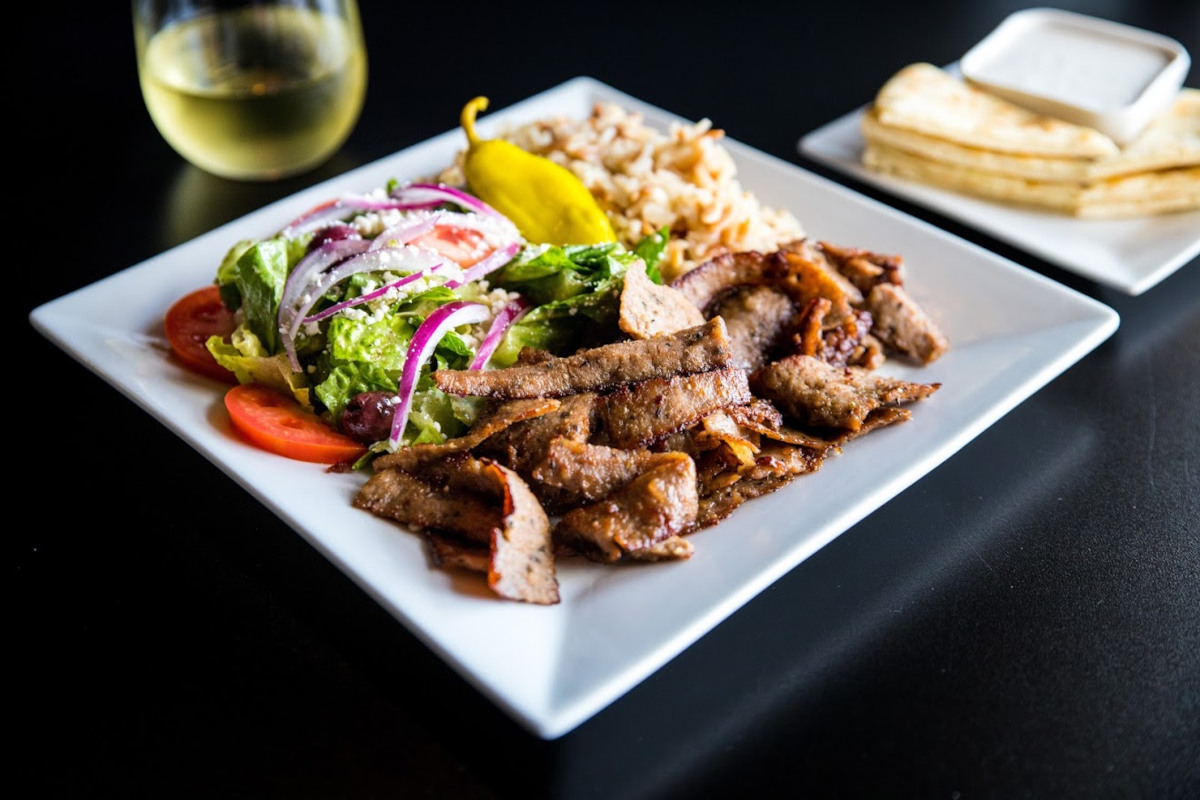 Grilled sliced meat and mixed salad